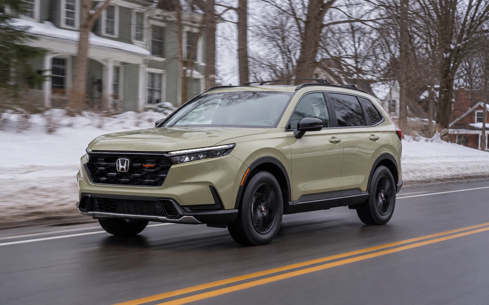 Honda CR-V TrailSport Hybrid driving in winter conditions near Troy, New York
