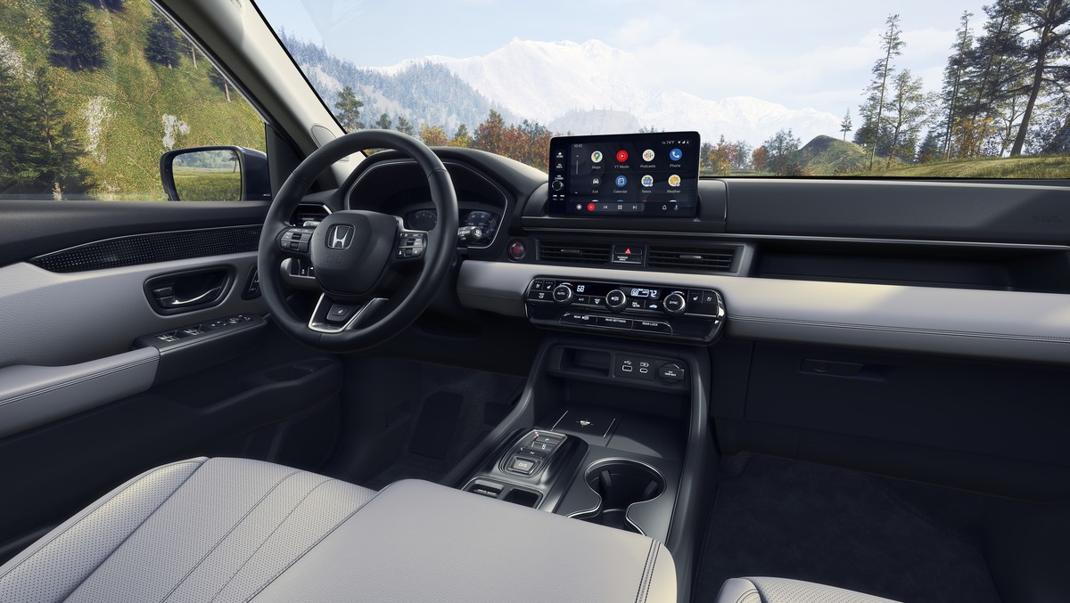 2026 Honda Pilot interior view of the dash with a moutain view out the windshield