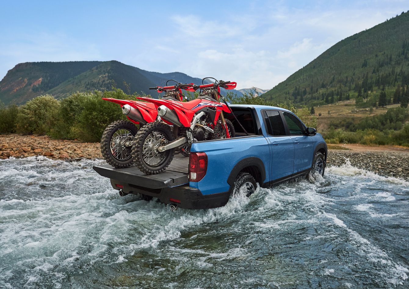 2025 Honda Ridgeline Water fording with two motorcross bikes on the back