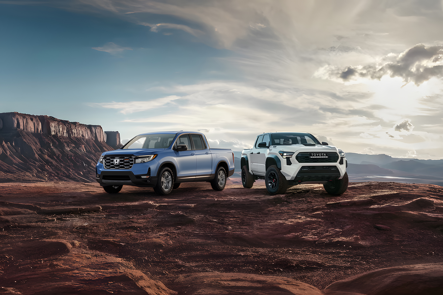 2026 Honda Ridgeline vs Toyota Tacoma parked on a bluff in the desert-UPSCALED