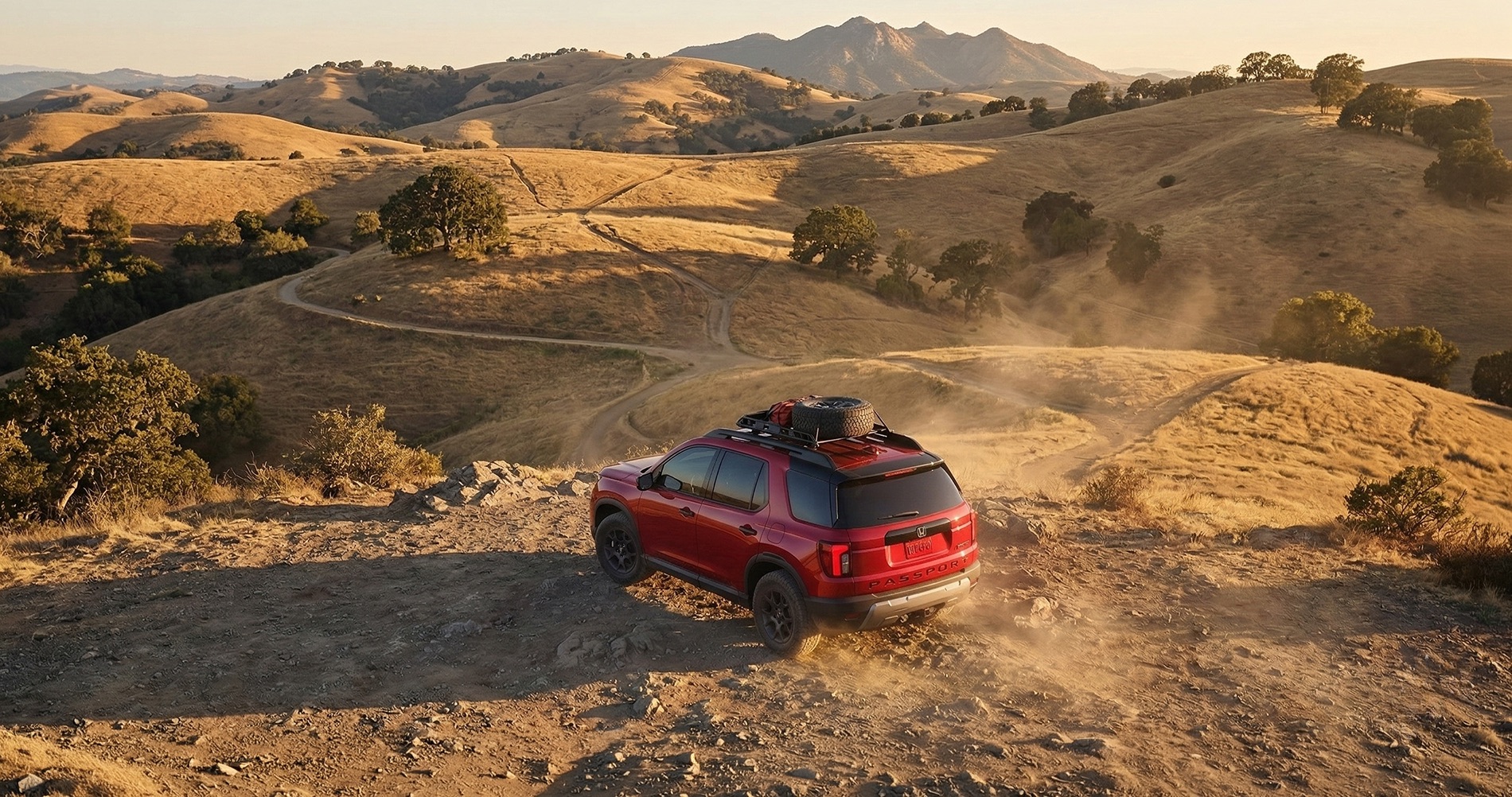 2026 Honda Passport adventure SUV driving on dirt trail in East Bay hills near Mount Diablo California