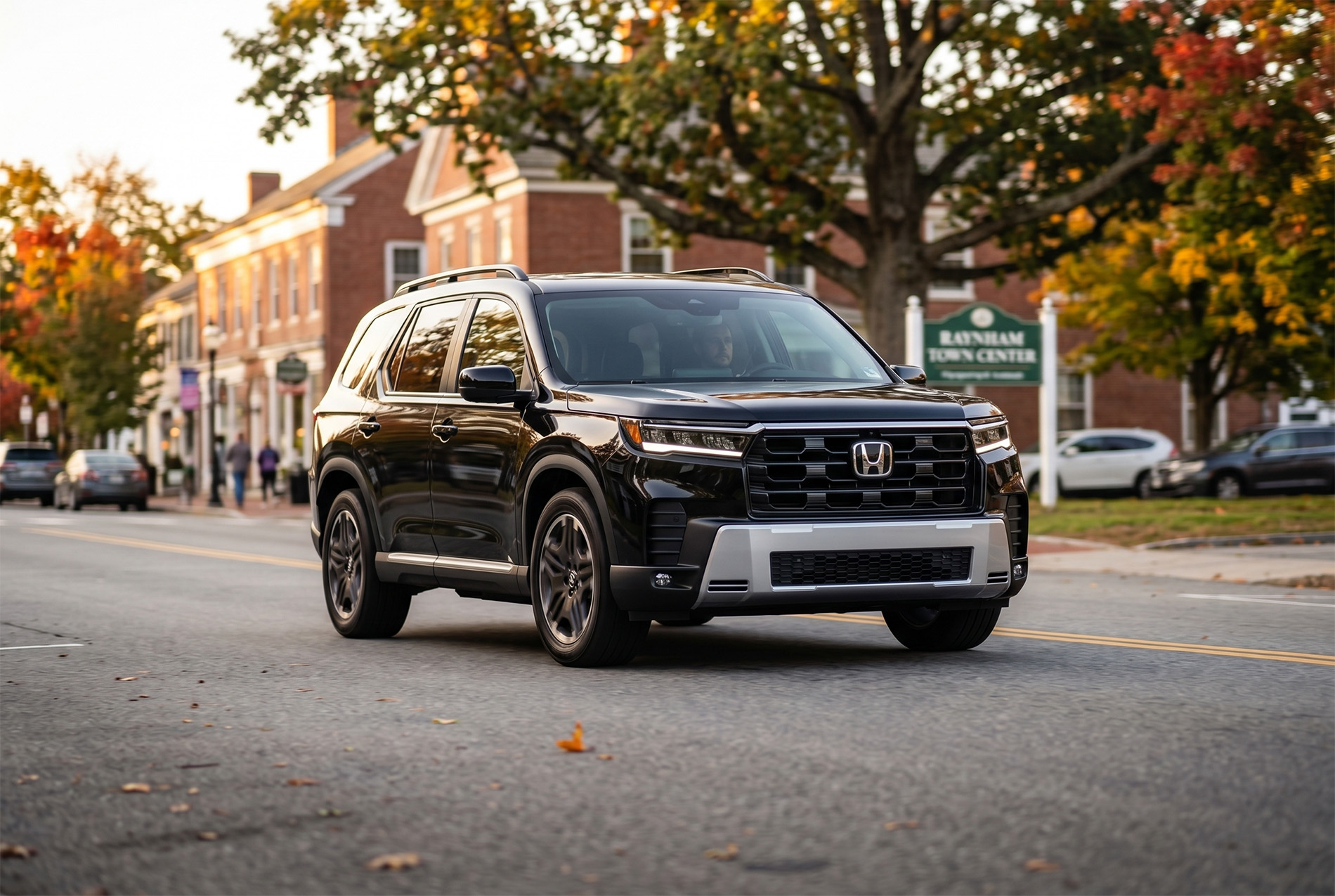 2026 Honda Pilot Touring Blackout trim level driving by Raynham Massachusetts town center