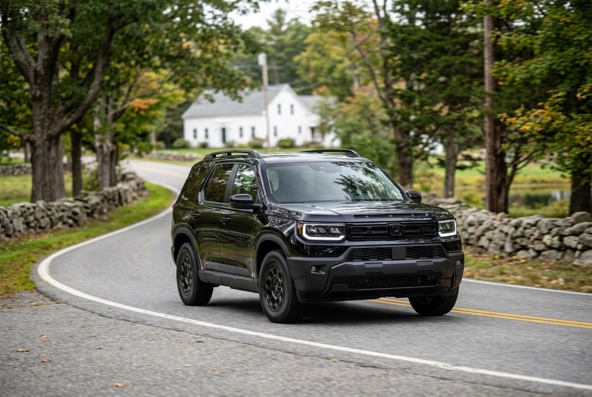 2026 Passport RTL Blackout trim level driving through a rural part of New England with an old white home in the background