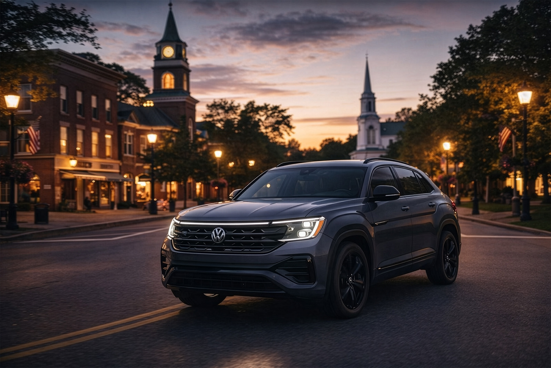 2026 Volkswagen Atlas Cross Sport driving through a New England city at night