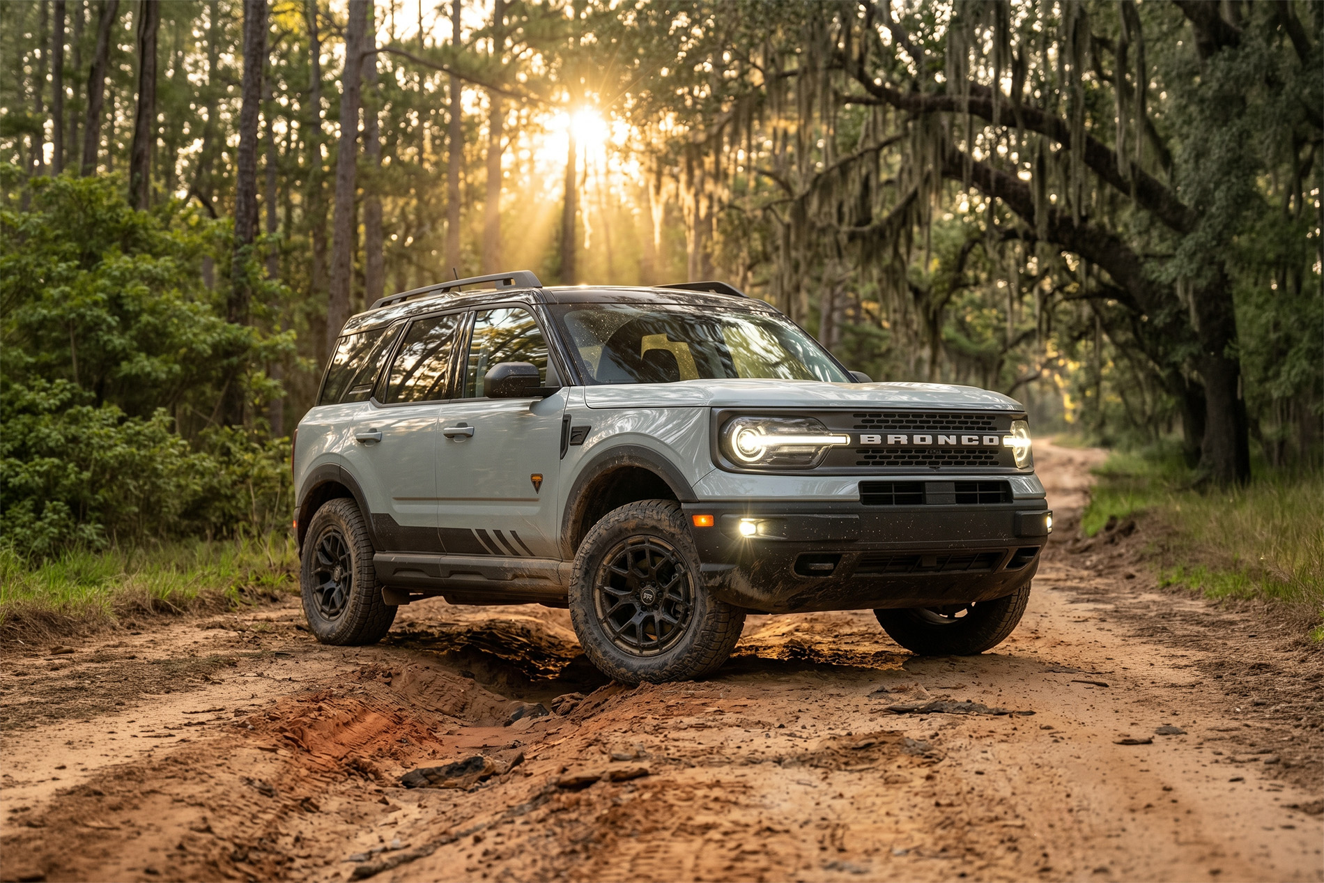 Bronco Sport RTR parked on a dirt trail through the forest
