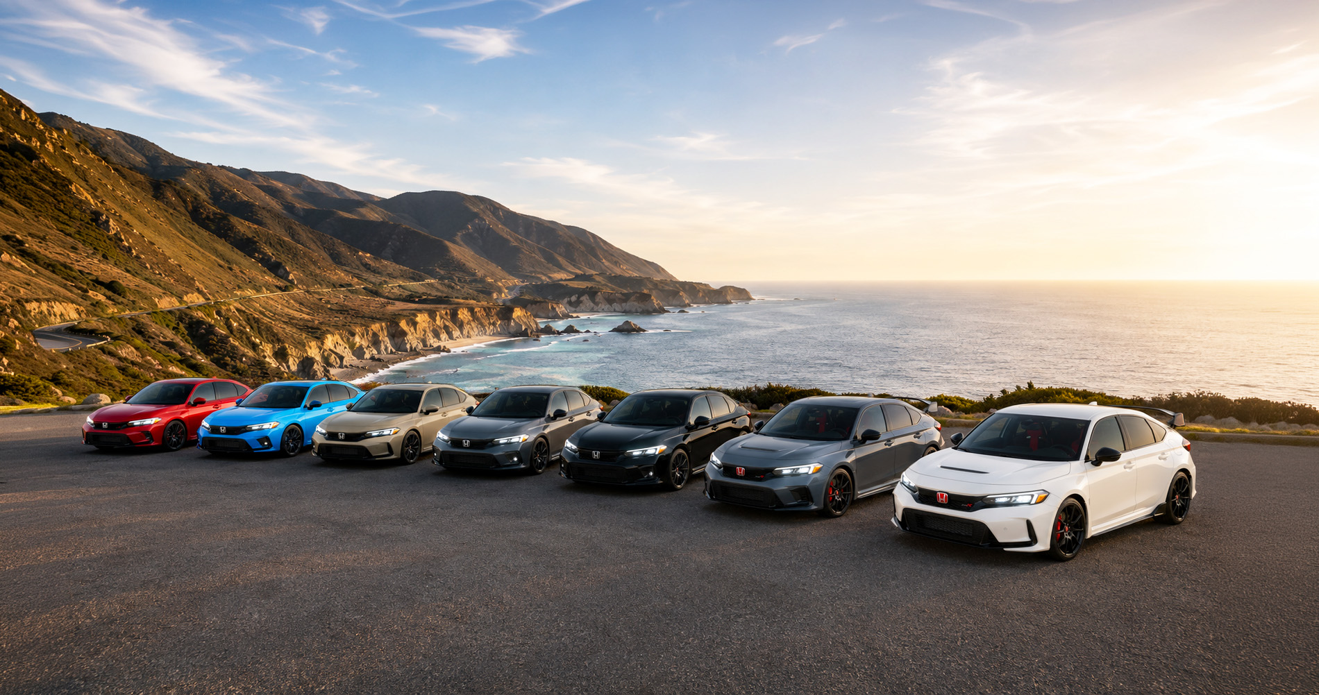 Seven 2026 Honda Civic models in red, blue, beige, dark gray, black, silver-gray, and white parked side by side on a scenic coastal overlook near Tracy, California, with rugged cliffs, winding roads, and the Pacific Ocean stretching into the distance under a golden sunset sky, showcasing the full range of Civic color options.