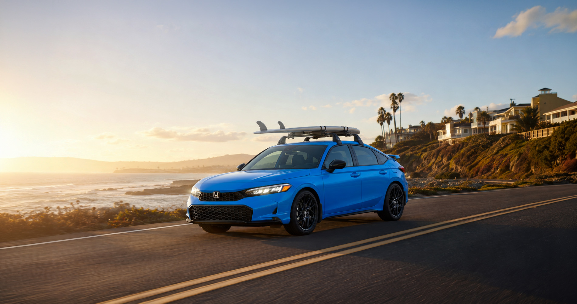 A bright blue Honda Civic hatchback with a roof rack carrying a surfboard drives along a coastal road at sunset near Tracy, California, with ocean waves, palm trees, and seaside homes in the background, highlighting lifestyle accessories for outdoor adventure.