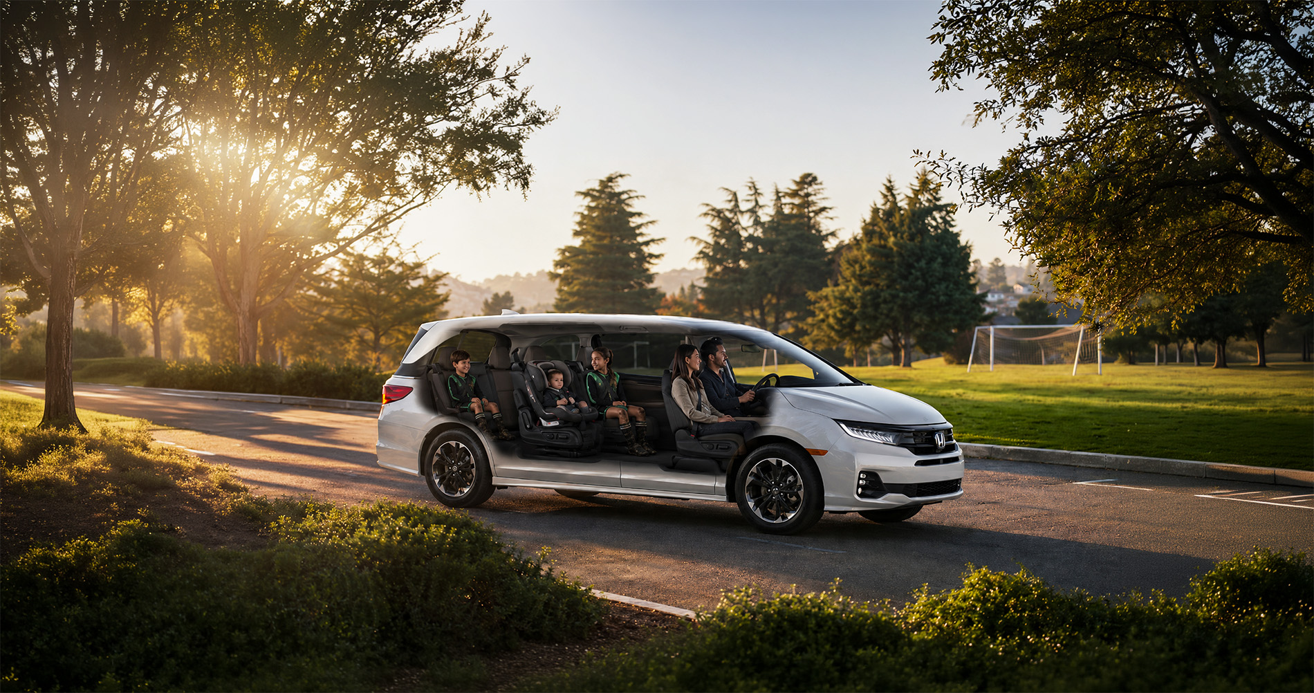 A white 2026 Honda Odyssey minivan drives through a tree-lined park in El Cerrito, California, with its semi-transparent body revealing a family of five inside—two adults in front and three children in the rear seats—showcasing the spacious cabin and versatile seating configuration under warm morning sunlight.