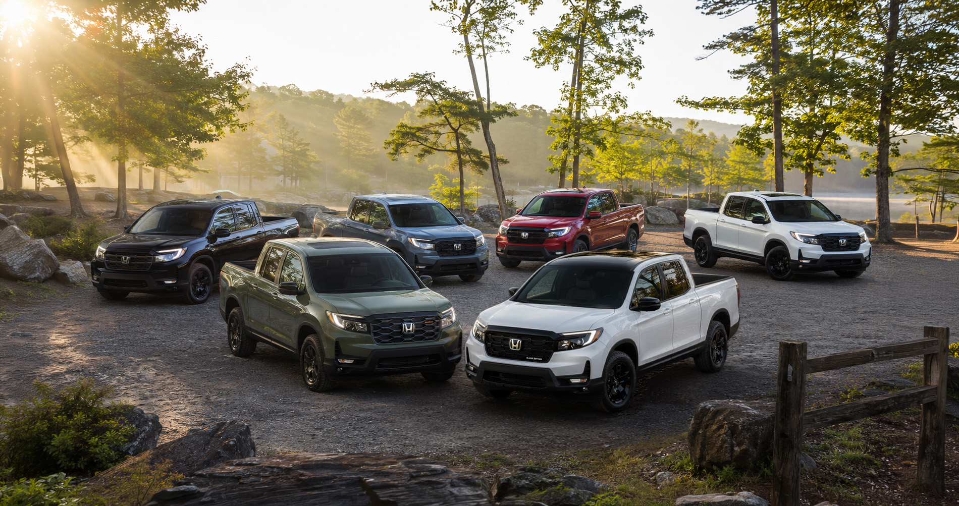 2026 Honda Ridgeline trim lineup parked in a scenic rural area.