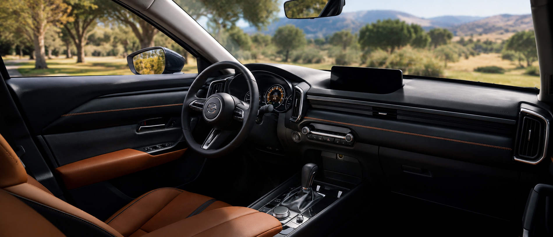 Black and brown leather cabin with digital display and refined dashboard design, highlighting craftsmanship and comfort.