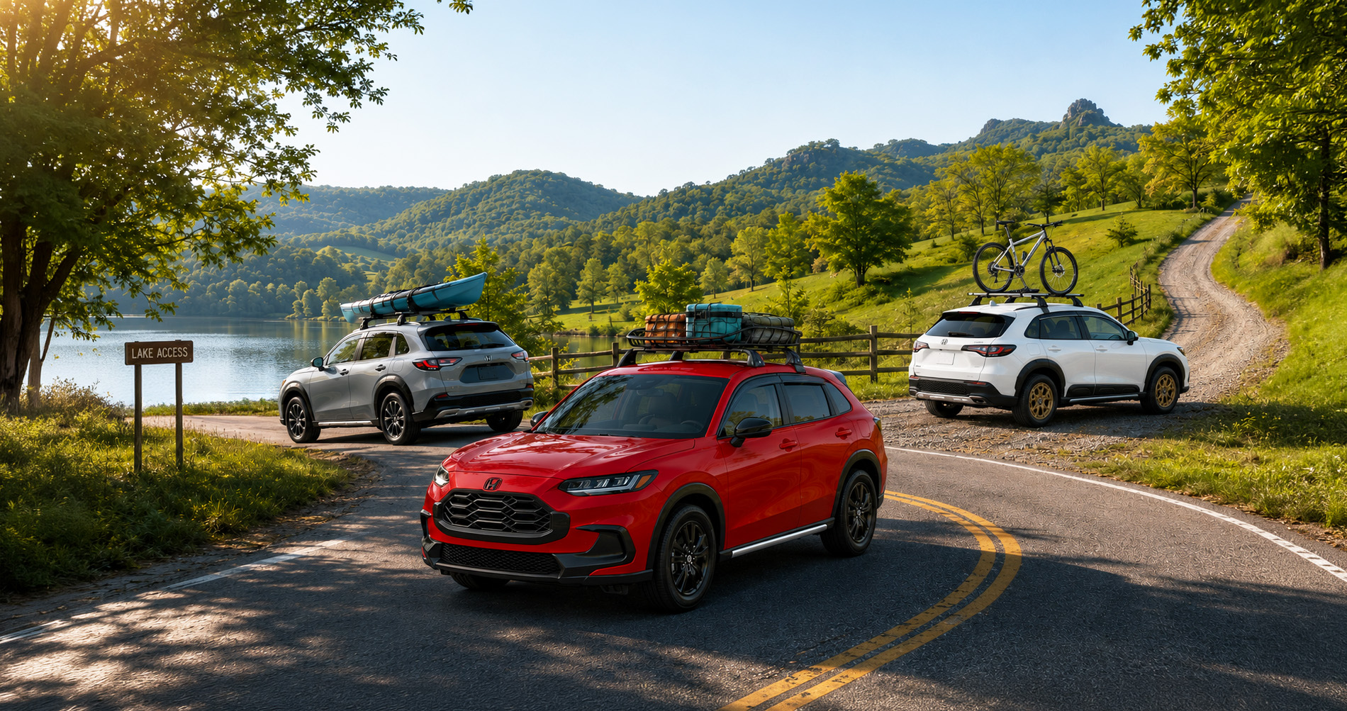 Three 2027 Honda HR-V SUVs with accessories driving near a lakeside launch area surrounded by green hills and trees under clear blue skies.