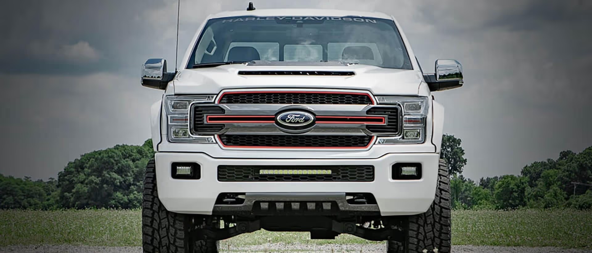 Harley-Davidson F-150 front view showing lifted stance, grille light bar, and custom front-end design