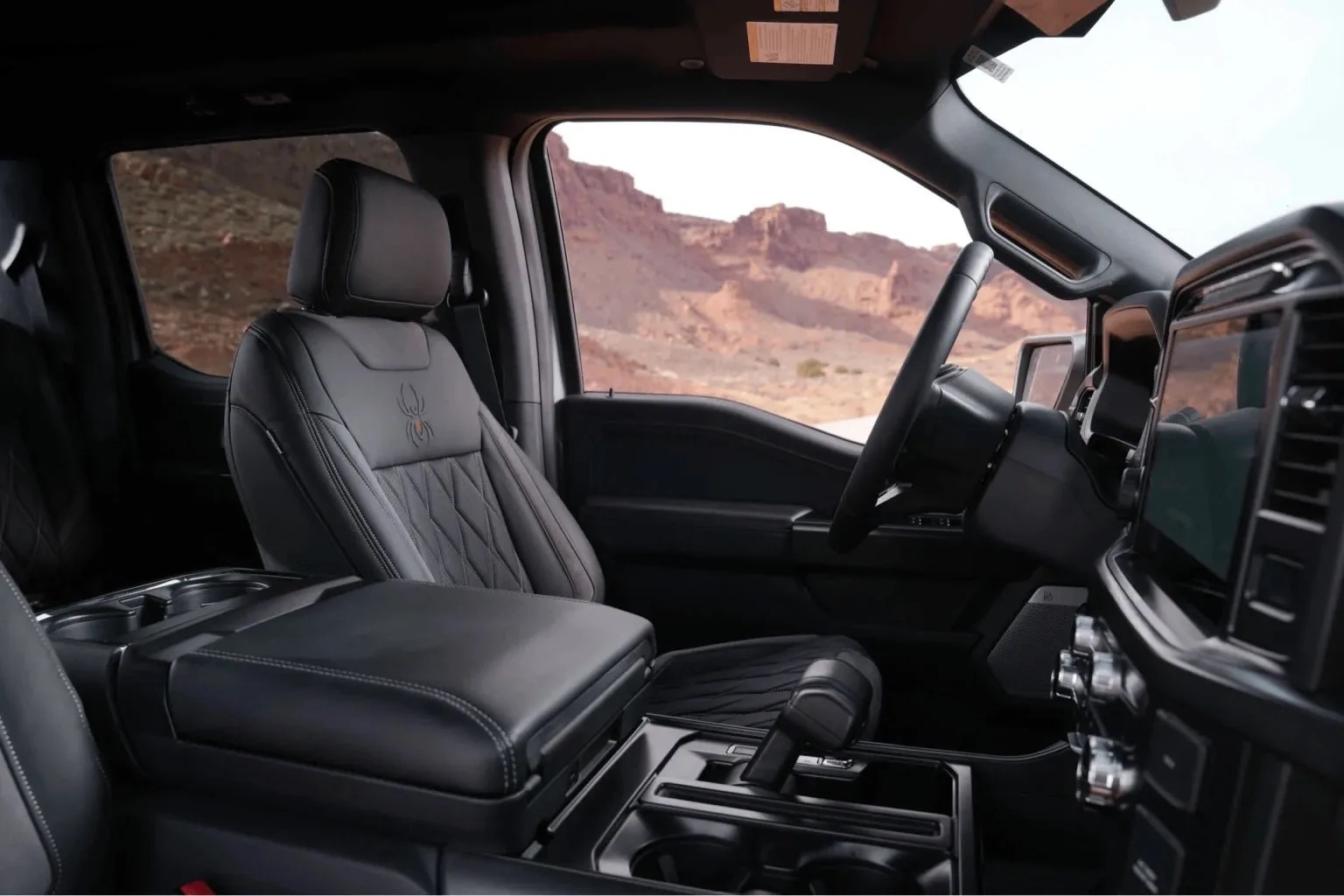 Black Widow truck interior with custom specialty trim and branded cabin details