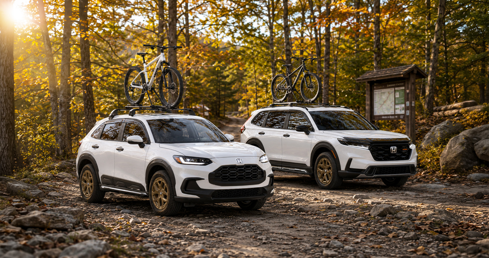 White Honda CR-V and Honda HR-V SUVs with bicycles on roof racks driving through a forest trail, emphasizing outdoor SUV capability.