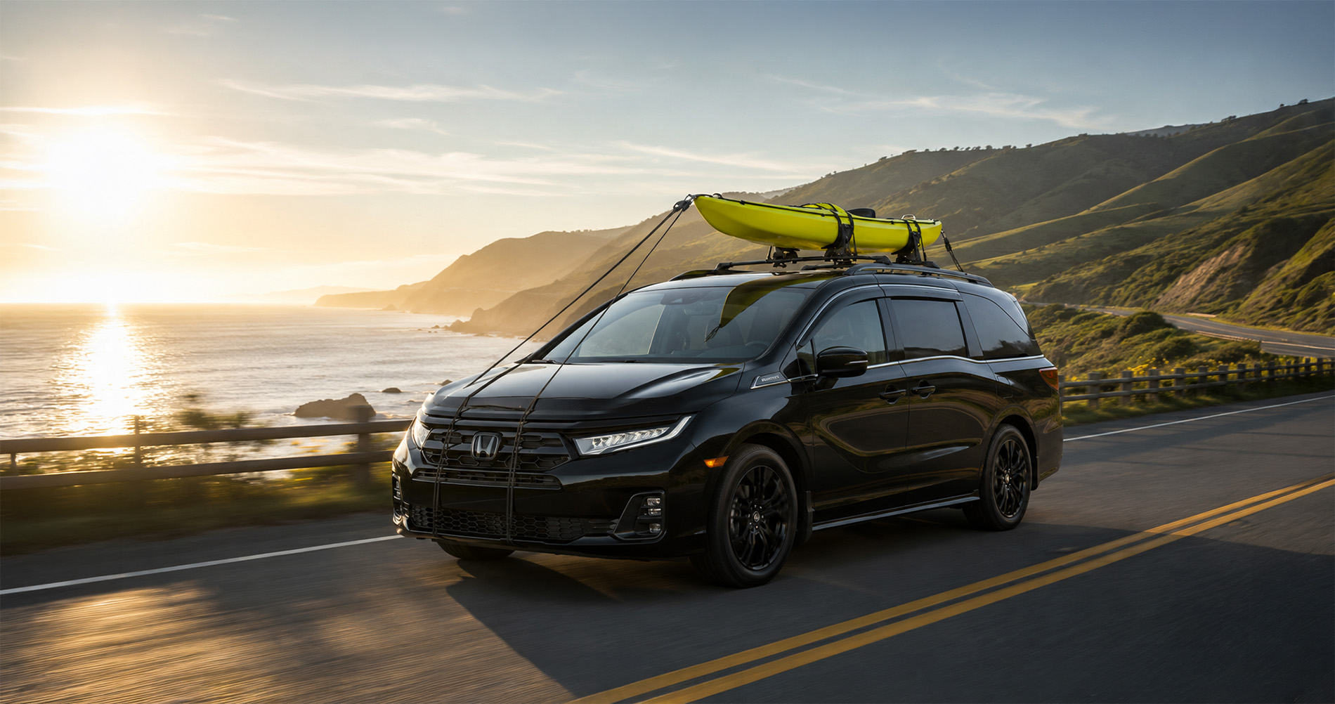 2026 Honda Odyssey Sport-L driving near the coastline with kayaks near Pittsburg California