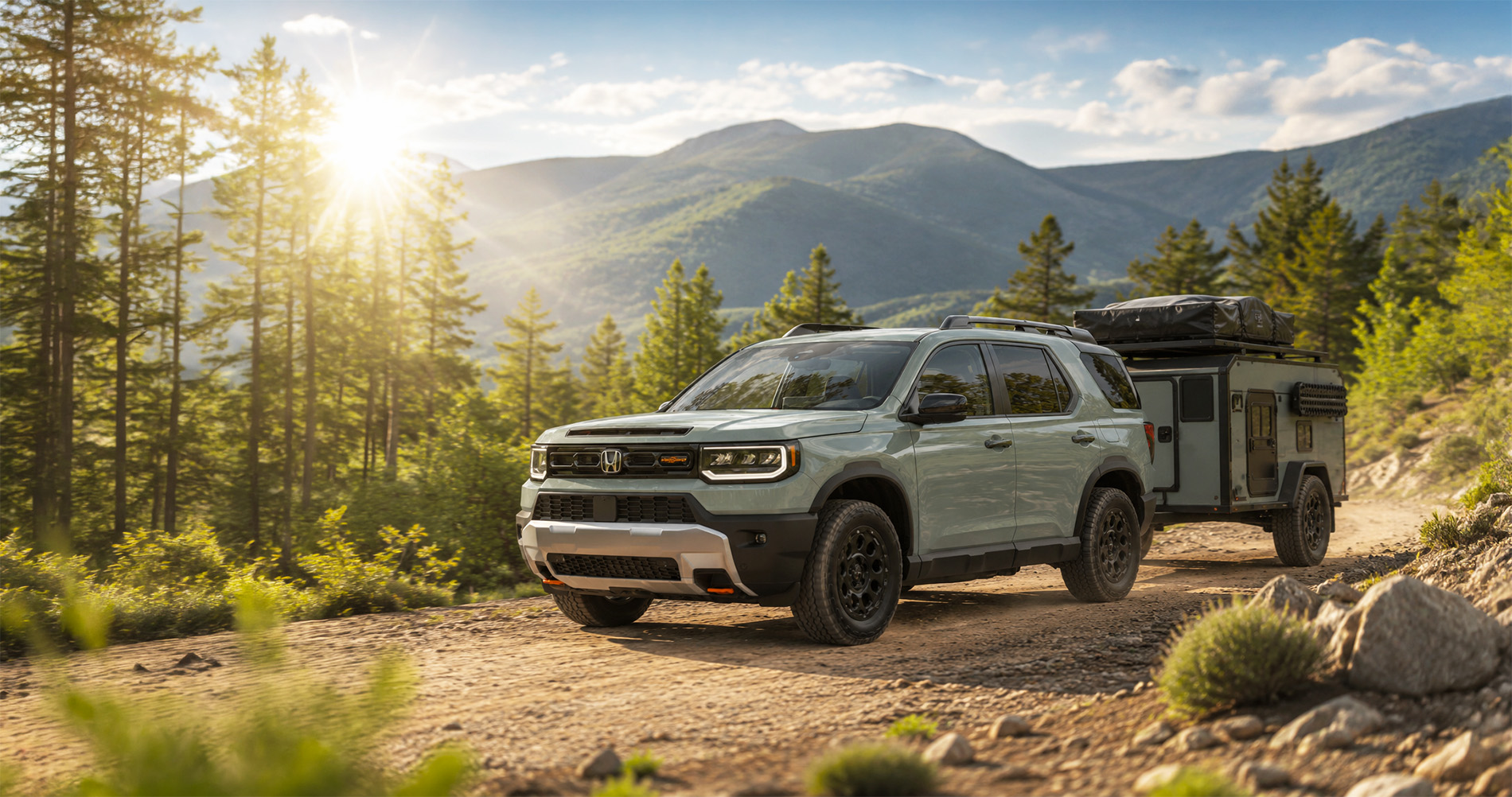 Sage Green Honda Passport TrailSport towing camping trailer on dirt mountain road at sunrise highlighting off-road capability.