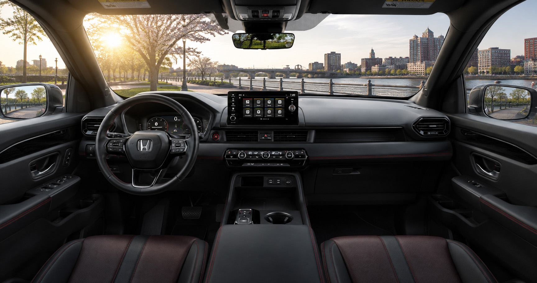 Black and red Honda Pilot cabin with touchscreen display and leather seats showcasing modern design and comfort.
