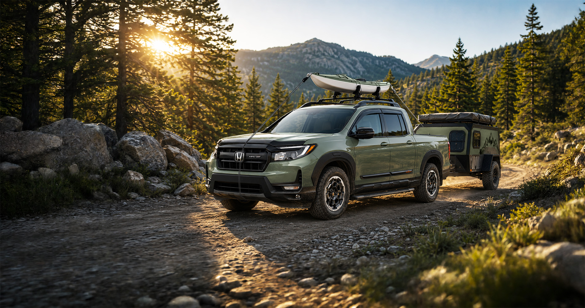 Green Honda Ridgeline towing a camper and carrying a kayak on a forest road, highlighting outdoor use and weekend recreation.