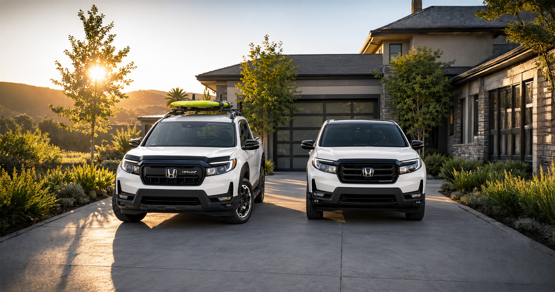 Two white Ridgeline trucks parked in modern driveway at sunrise, one with kayak on roof, showcasing trim options.