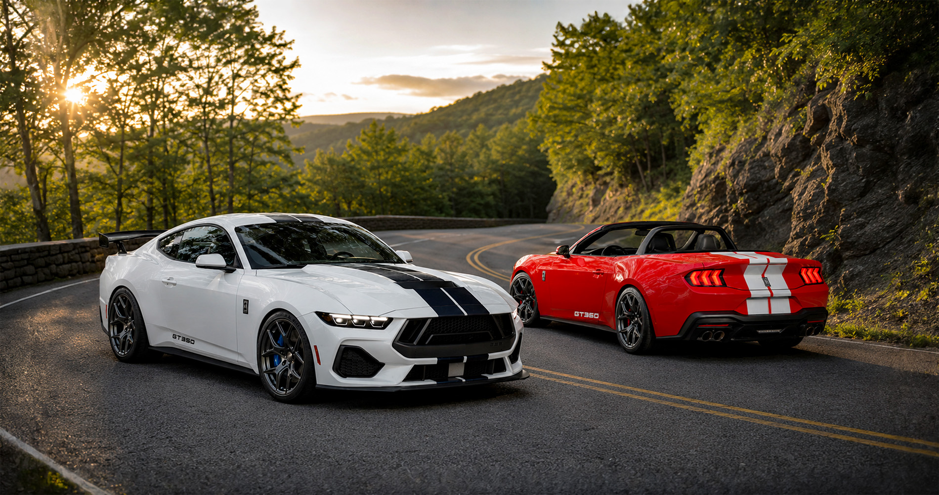 White Shelby Mustang GT350 coupe and red GT350 convertible parked on winding mountain road at sunset highlighting performance design and racing stripes.