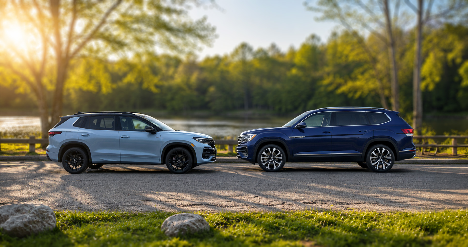 Light-blue Volkswagen Tiguan and dark-blue Volkswagen Atlas shown side by side to compare their exterior size and proportions.