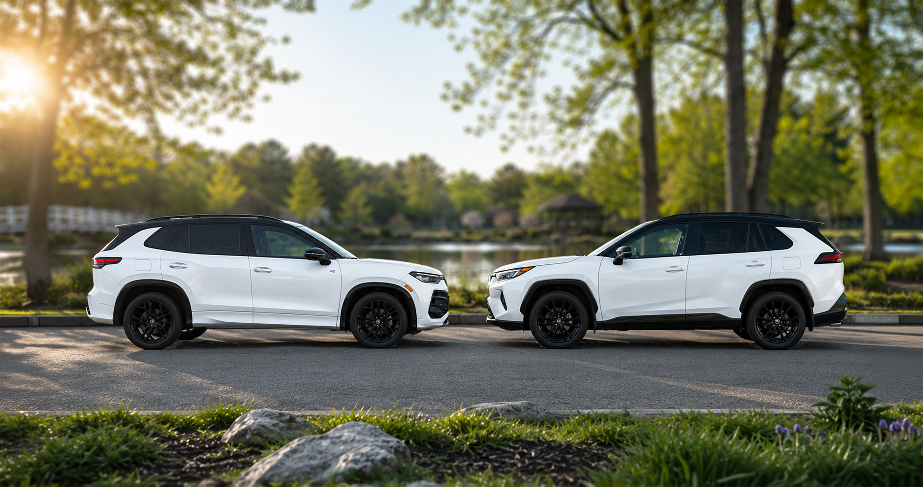 White Tiguan and RAV4 SUVs parked lakeside at sunset, emphasizing side profiles and proportions.