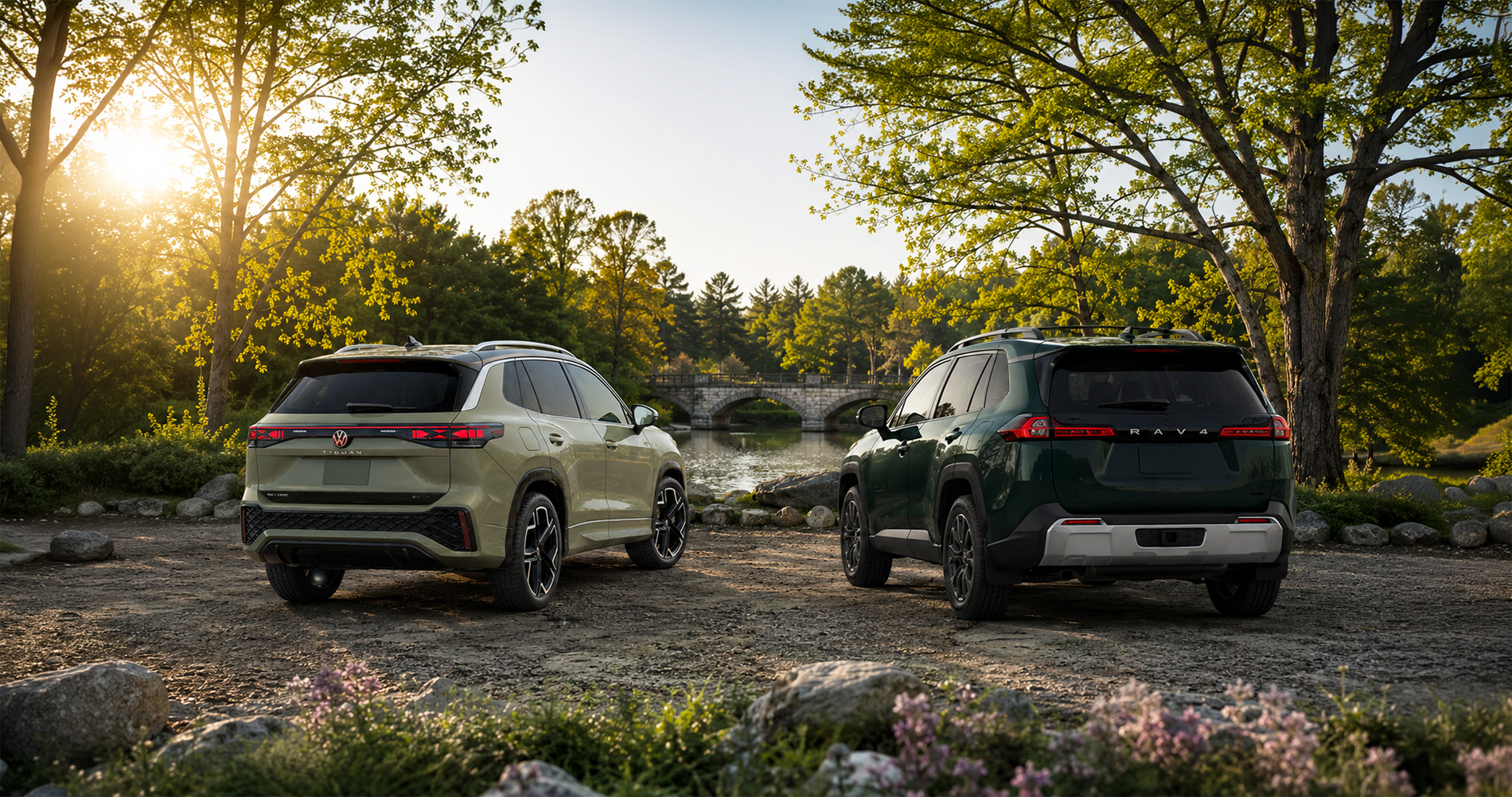 Green Tiguan and RAV4 SUVs parked near a stone bridge at sunrise, highlighting outdoor capability and rear design.
