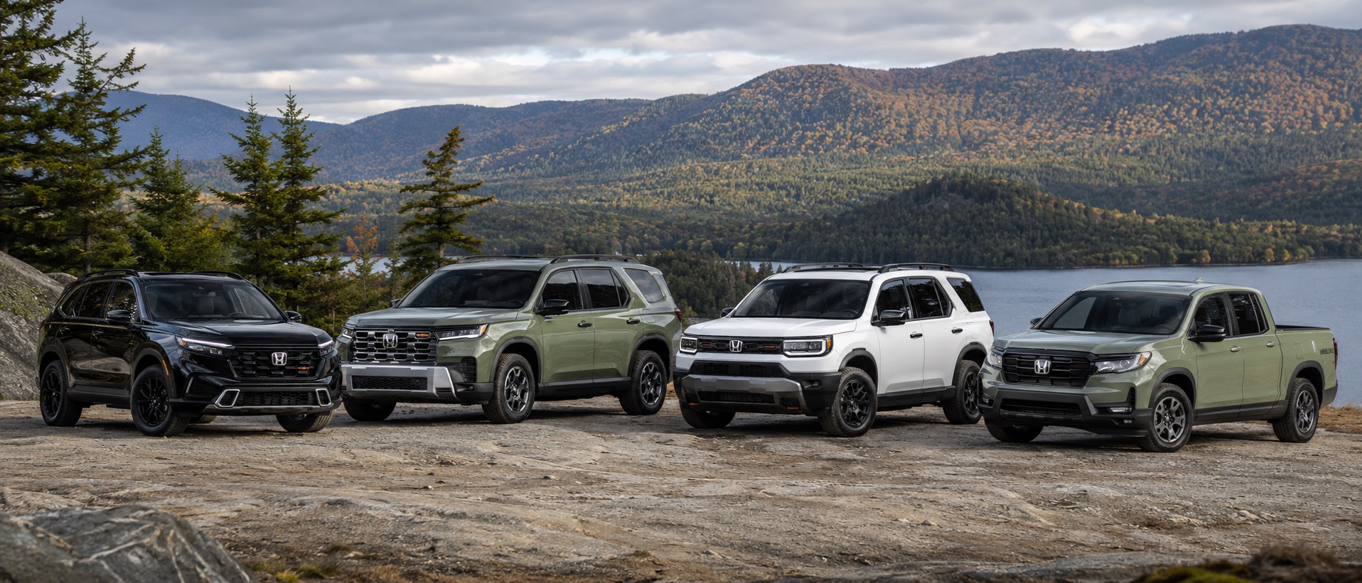 2026 Honda TrailSport lineup at an Adirondack Mountain overlook, featuring the CR-V, Pilot, Passport, and Ridgeline