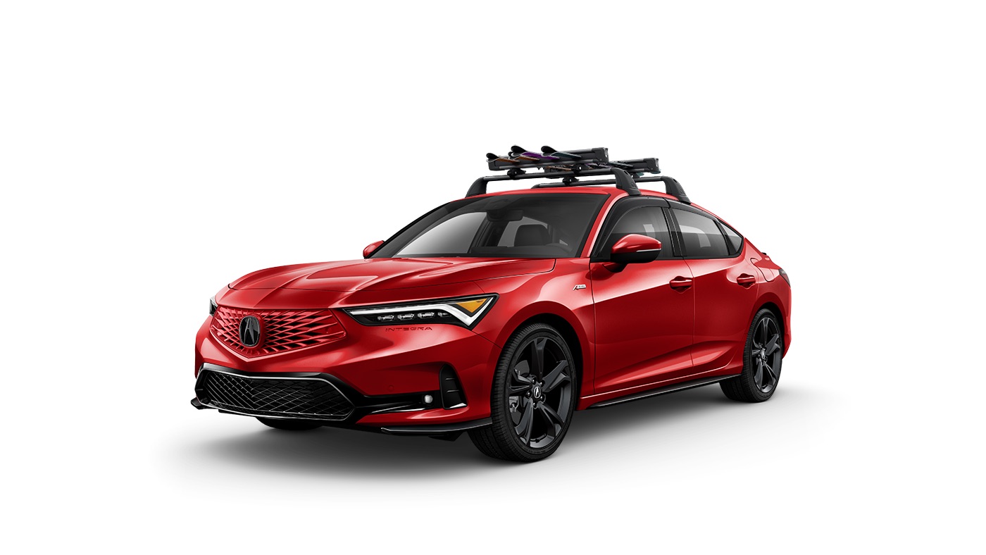Red 2026 Acura Integra with a roof rack carrying winter sports