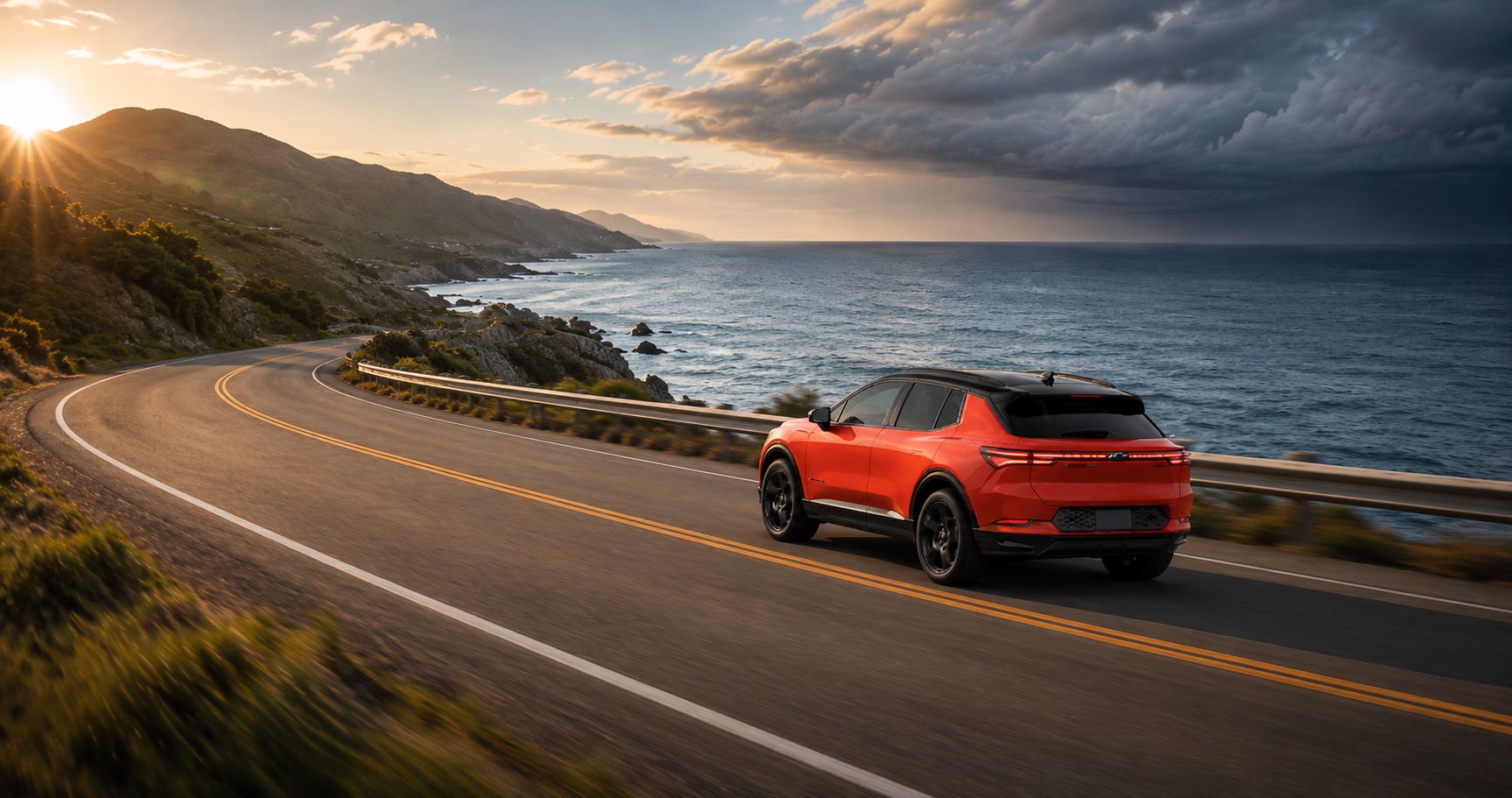Orange Chevrolet Equinox EV driving along coastal highway at sunrise with ocean and cliffs in background emphasizing sleek styling and electric performance.