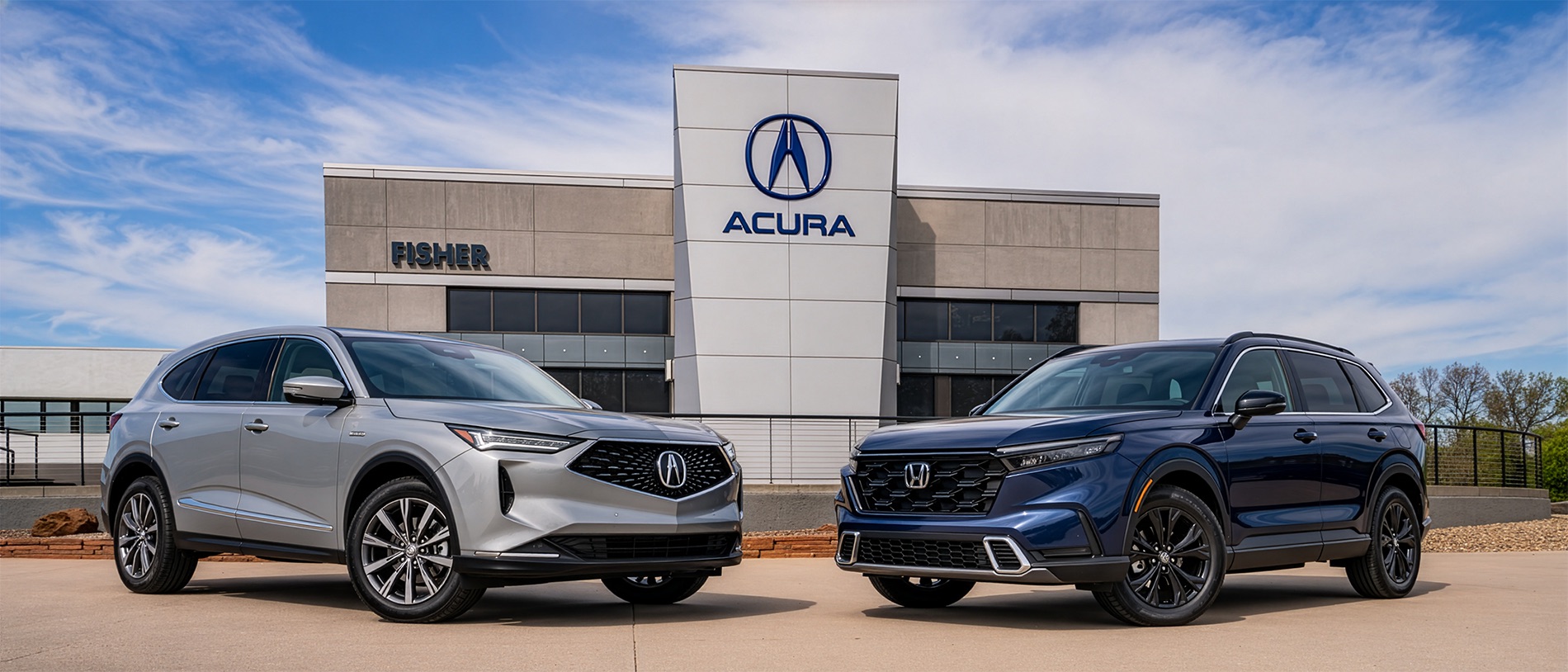 2026 Acura RDX and 2026 Honda CR-V Sport Touring parked side by side outside Fisher Acura in Boulder, Colorado.