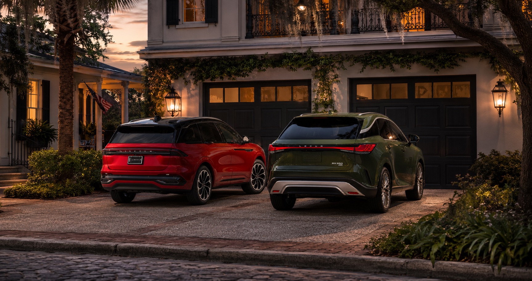 Red Lincoln Nautilus and green Lexus RX parked in a driveway at dusk in front of a historic home.