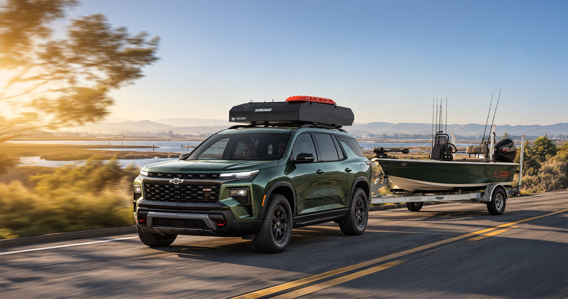 2027 Chevrolet Traverse Z71 towing a fishing boat along a waterfront road near Pittsburg, CA