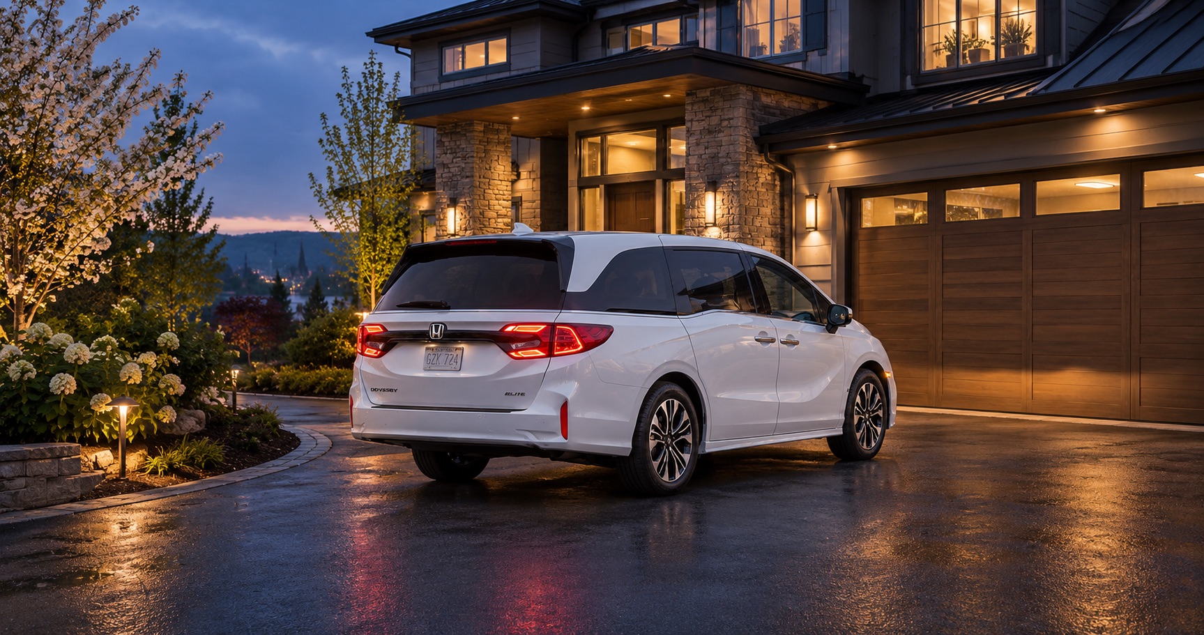 2027 Honda Odyssey Elite parked in the driveway of a home at dusk in Troy, NY