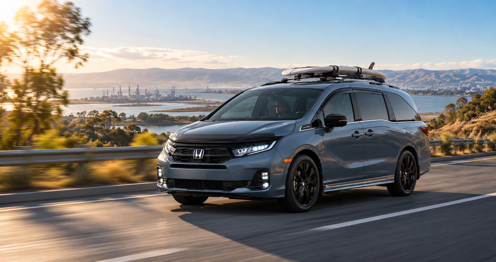 2027 Honda Odyssey Sport-L driving with surfboards on the roof near Pittsburg, CA
