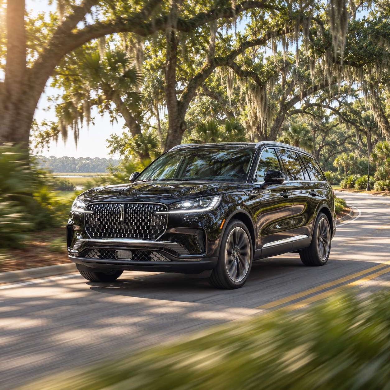 2026 Lincoln Aviator Reserve driving on a tree-lined road near Hilton Head Island South Carolina