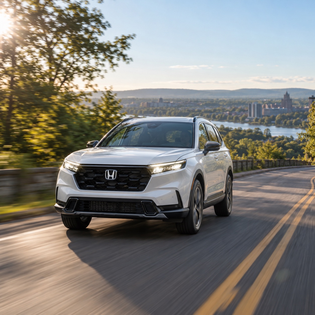 White 2026 Honda CR-V driving through a scenic summer road in New York’s Capital Region near Albany and Troy.