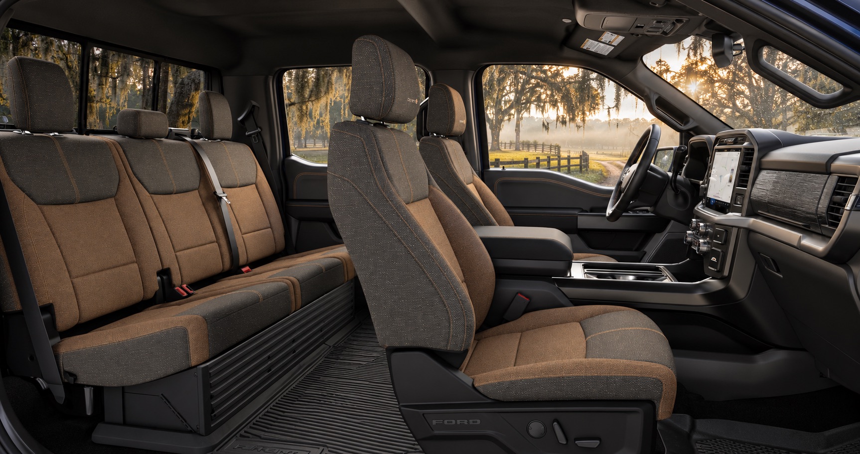 2027 Ford F-150 XLT Carhartt Edition interior with brown-and-black upholstery overlooking a rural Savannah, GA landscape