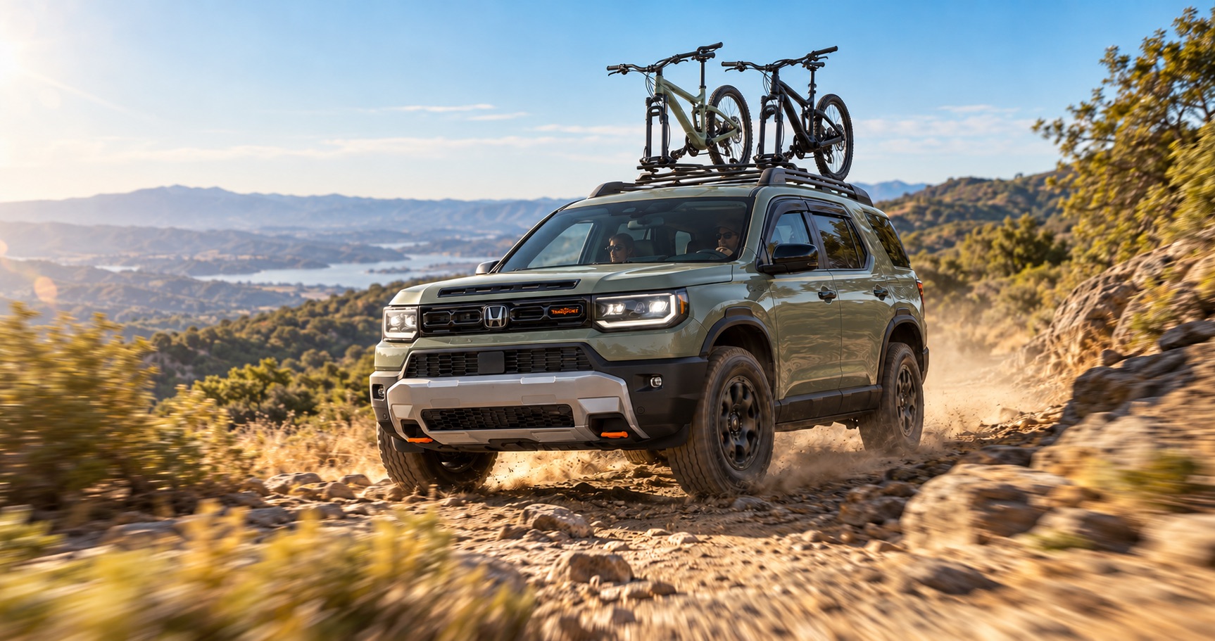 2027 Honda Passport TrailSport driving on a rugged mountain trail in Northern California with two mountain bikes on the roof