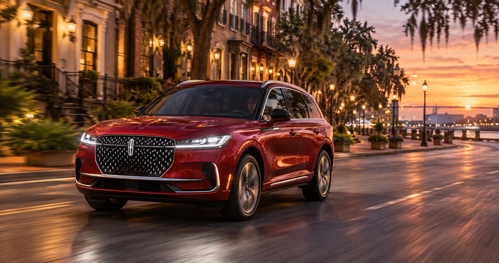 2027 Lincoln Corsair Hybrid driving along a historic waterfront street in Savannah, GA