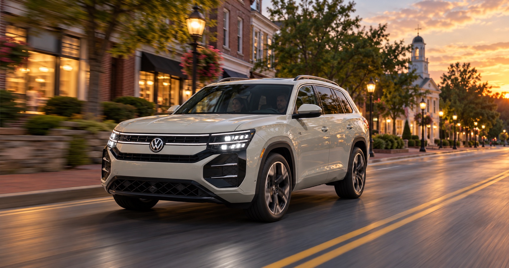 2027 Volkswagen Atlas SEL Premium R-Line driving through downtown Easton, MA at dusk