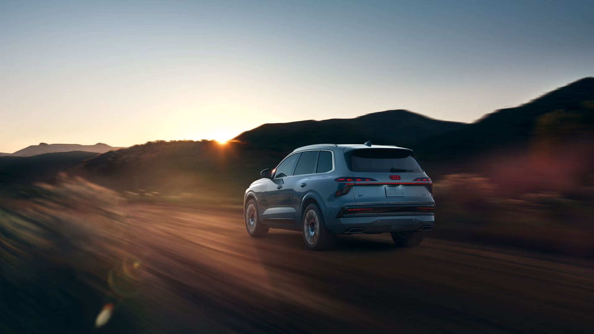 Audi Q7 three-row luxury SUV exterior; some front-end details differ across 2020–2024 model years.